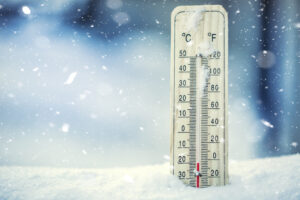 Thermometer on snow shows low temperatures