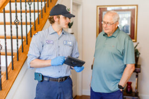Meetze Plumbing in Columbia, SC 3 Meetze Plumber with Tablet Working with Client