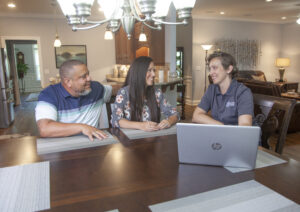 Meetze Plumbing in Irmo, South Carolina 2 Local plumbers talking with customers in their home