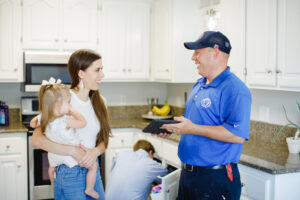 Local plumbers working on kitchen plumbing
